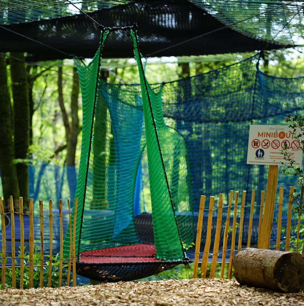 Parcabout® treetop nets: a course to follow on nets in the trees in the adventure park near Morlaix, Brittany